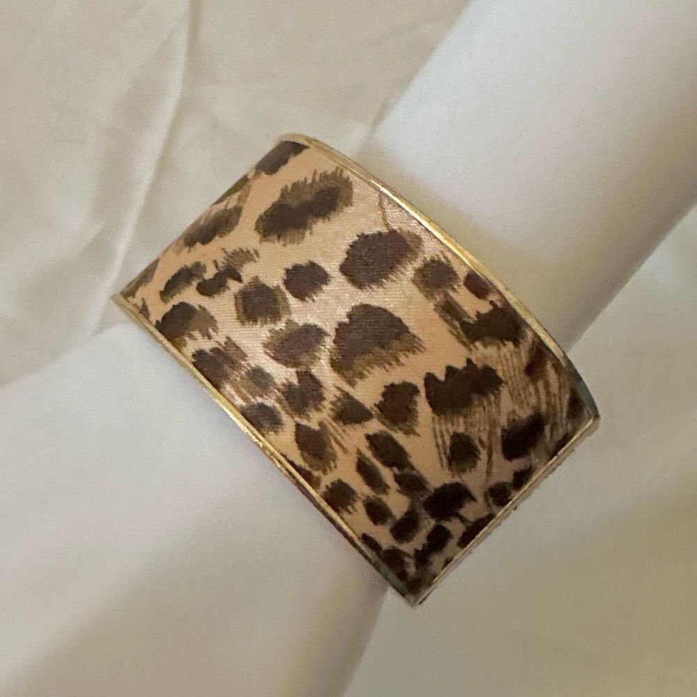 Gold tone leopard hinged bangle bracelet